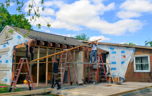 The first of two engineered beam goes up. The beams are a key structural element of our addition.