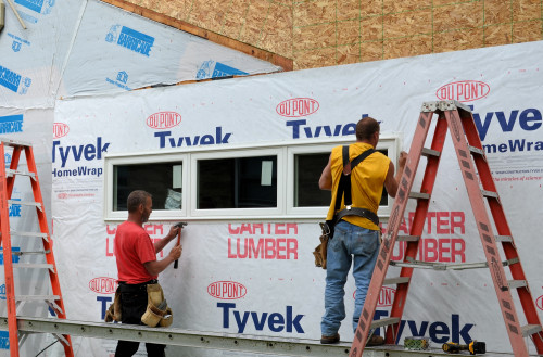 Nails, nails, and more nails to secure this big window to the framing.