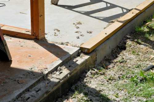 Bad news. The southwest corner of the original foundation is an inch higher than the rest of the bedroom floor!