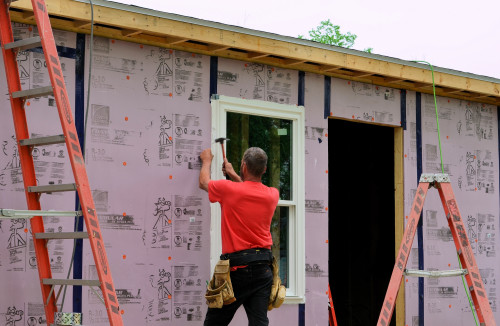 Fastening the window to the frame.