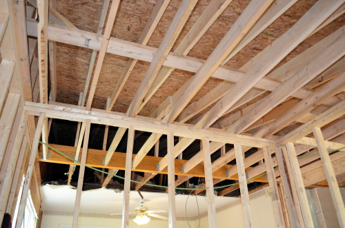 Complex framing for the new roof. The yellow VERSA-LAM beams replace a load-bearing wall.