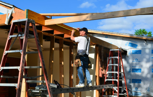 The first of many ceiling joists is in place.