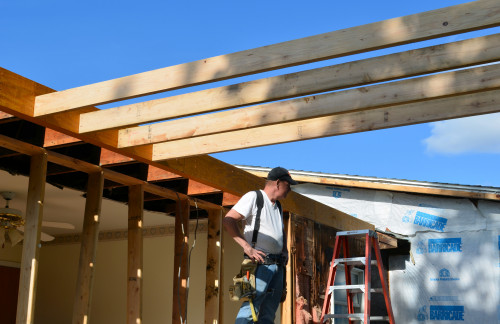 One by one, the joists are cut and fastened in place.