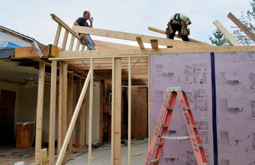 Each lower rafter is connected between the knee wall and the new south wall.