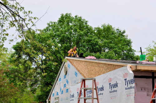 The last few shingles being installed.