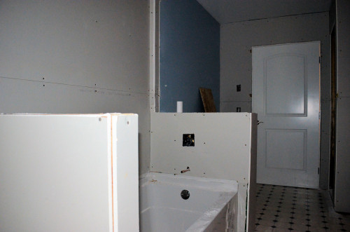 Bathroom: Some of the old drywall (painted blue) was preserved.