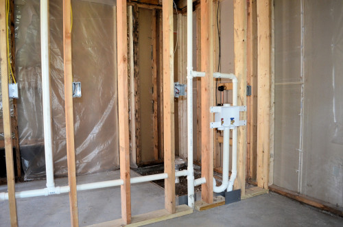 Drain and vent plumbing in the laundry.