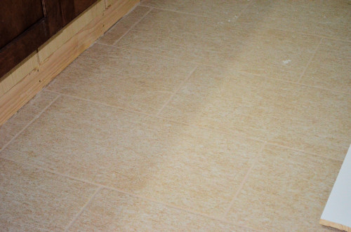 Floor tile with grout (closeup).