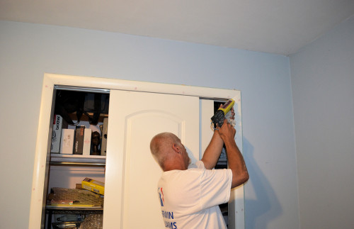 Caulking the door frames.