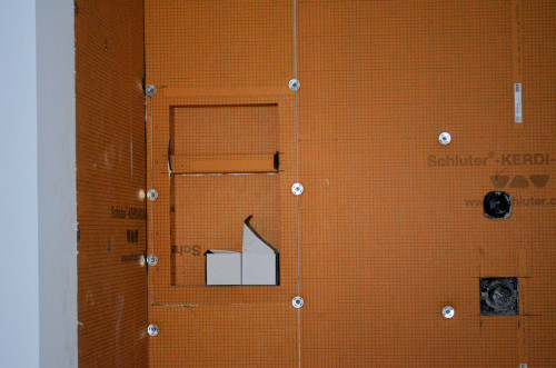 The KERDI-BOARD system includes a ready-made niche for bathing materials.